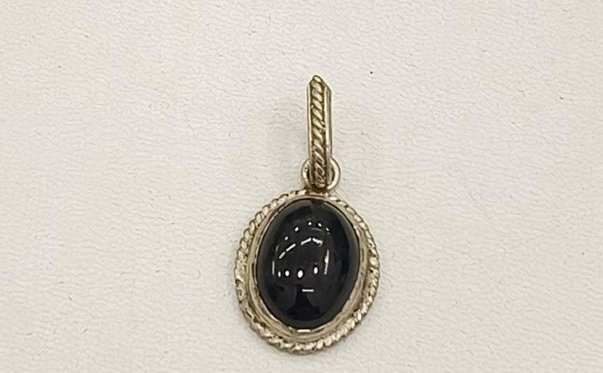 7.80/GM BLACK STAR SILVER PENDANT (525.00)