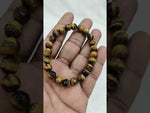 Load and play video in Gallery viewer, TIGER EYE FACETED BRACELET